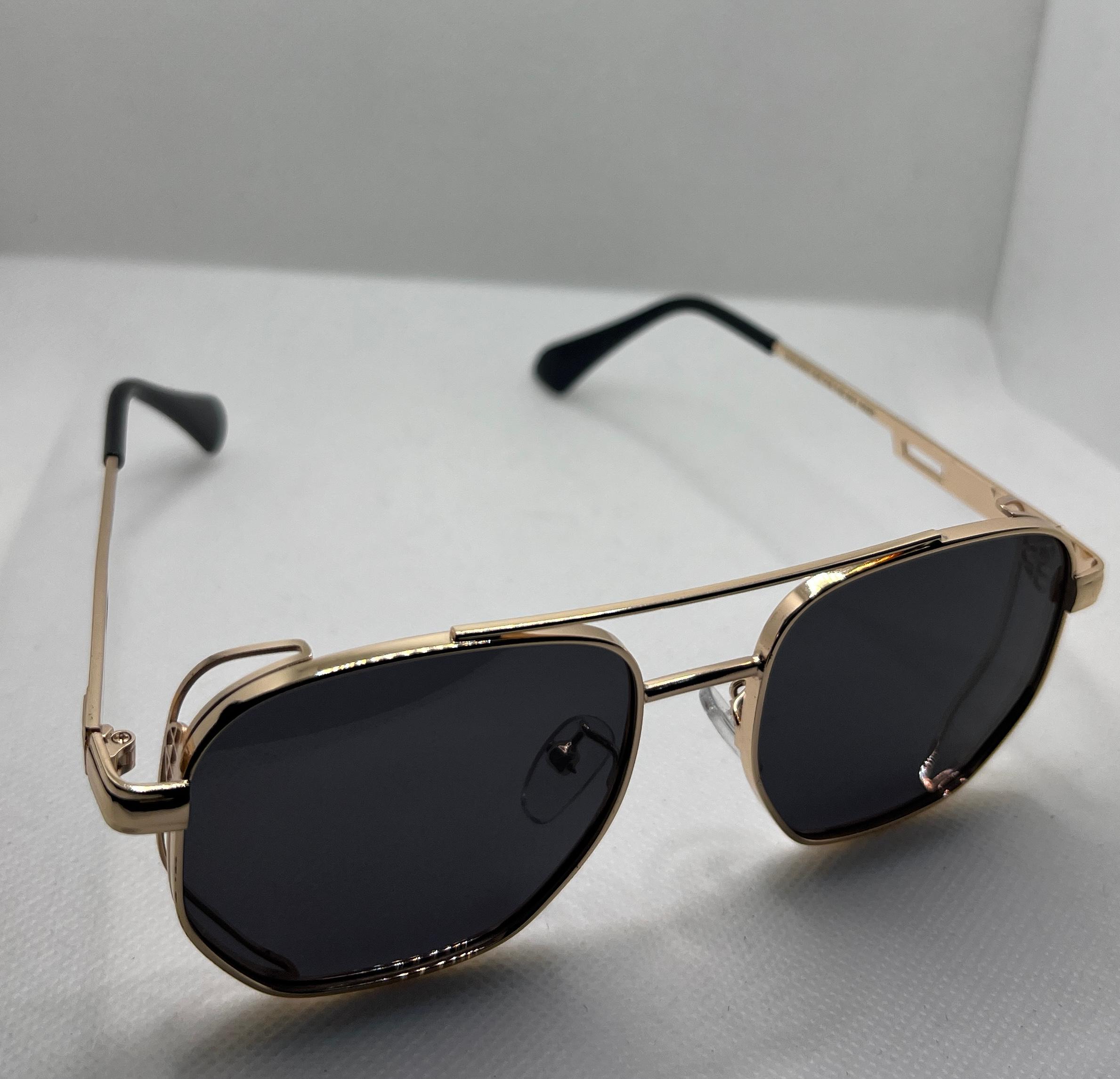  Meeran polo sunglasses with blue lenses and a black/gold frame, featuring UV protection